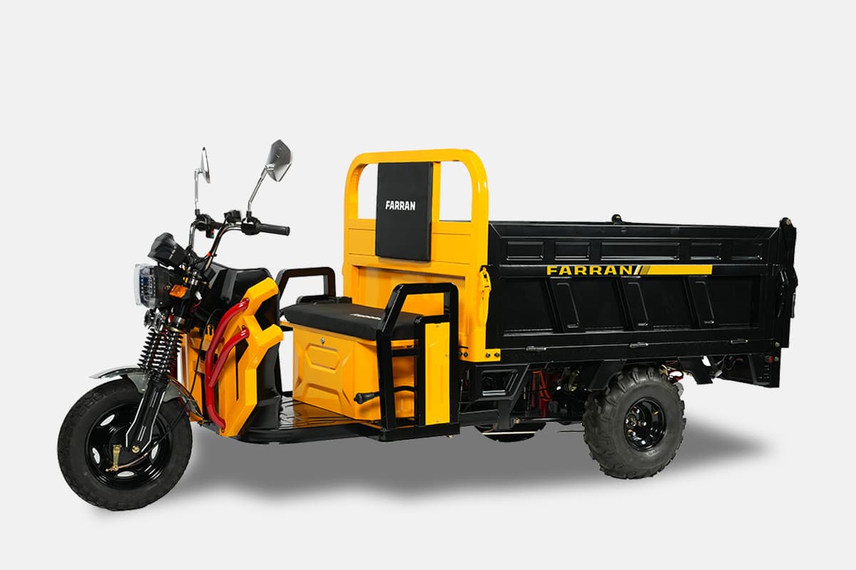 Yellow and black three-wheeled vehicle with a cargo bed on a white background