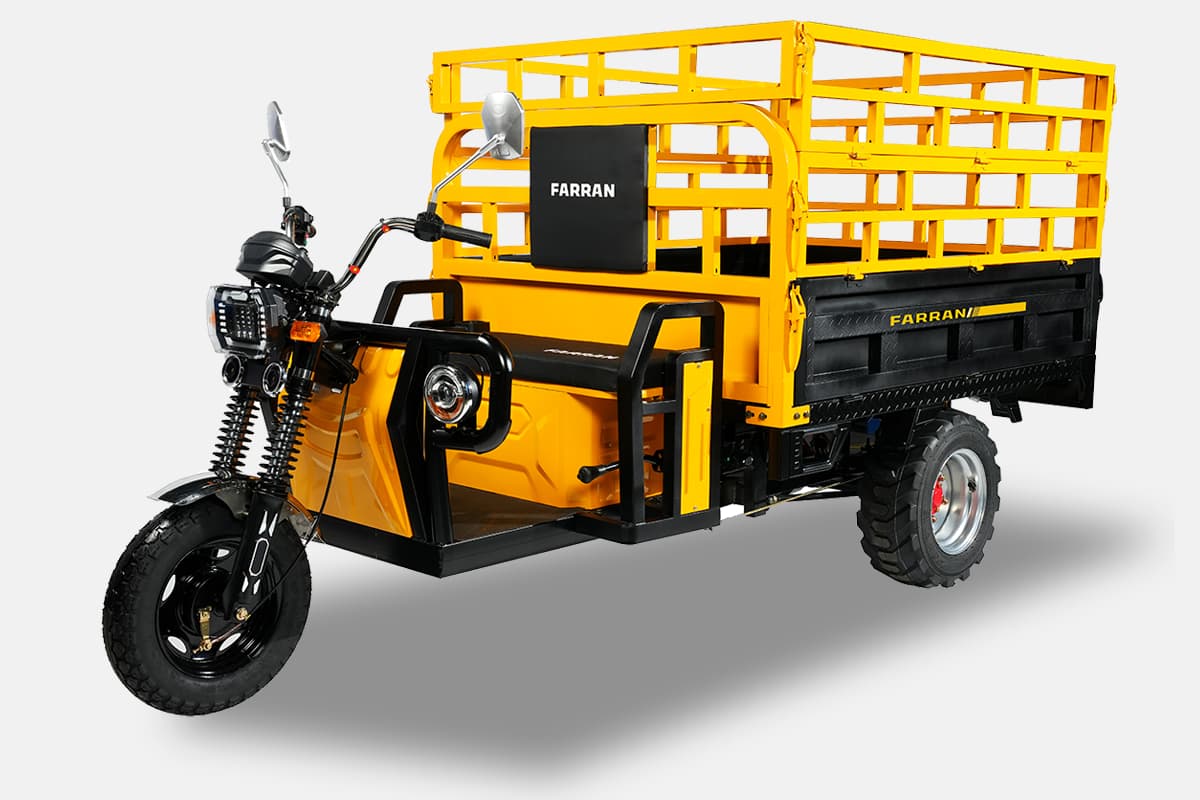 Yellow and black cargo tricycle with a cage on a white background
