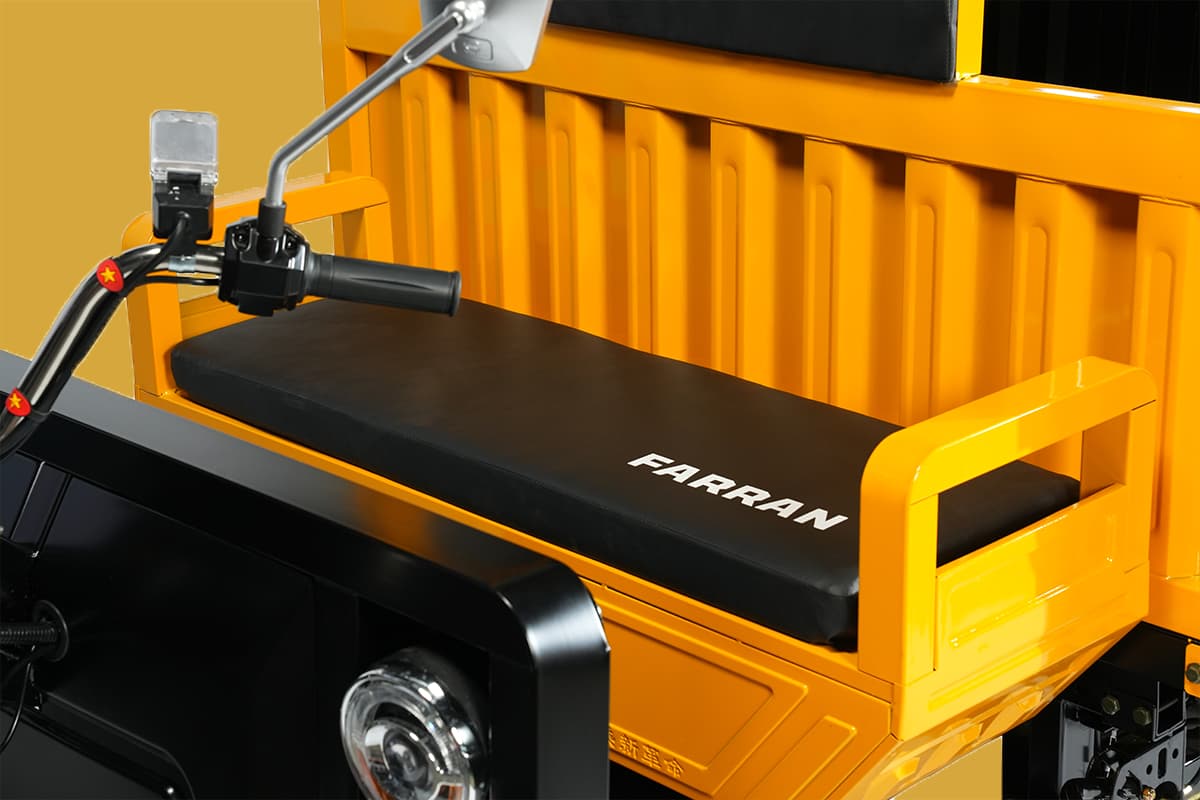 Yellow vehicle with black seat and 'FARRAN' branding on a yellow background