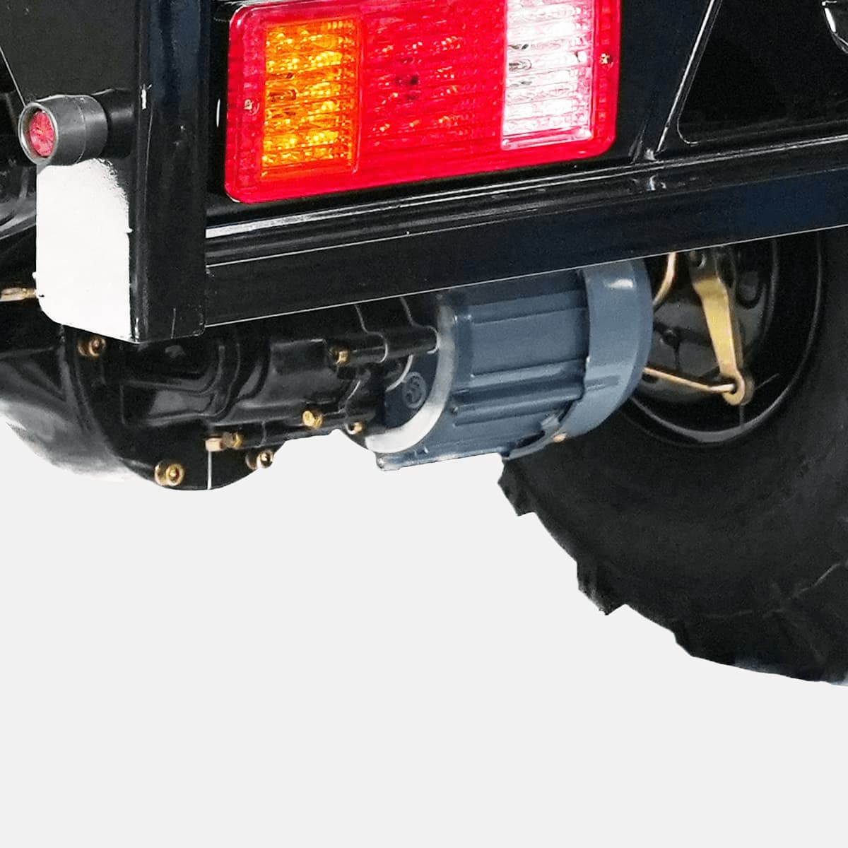 Close-up of a vehicle's rear bumper with a red taillight on a white background