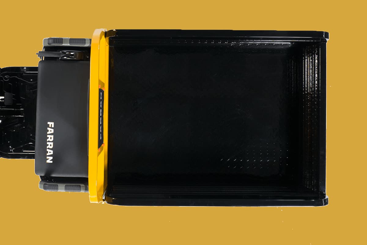 Black and yellow storage box with 'Farran' branding on a mustard yellow background